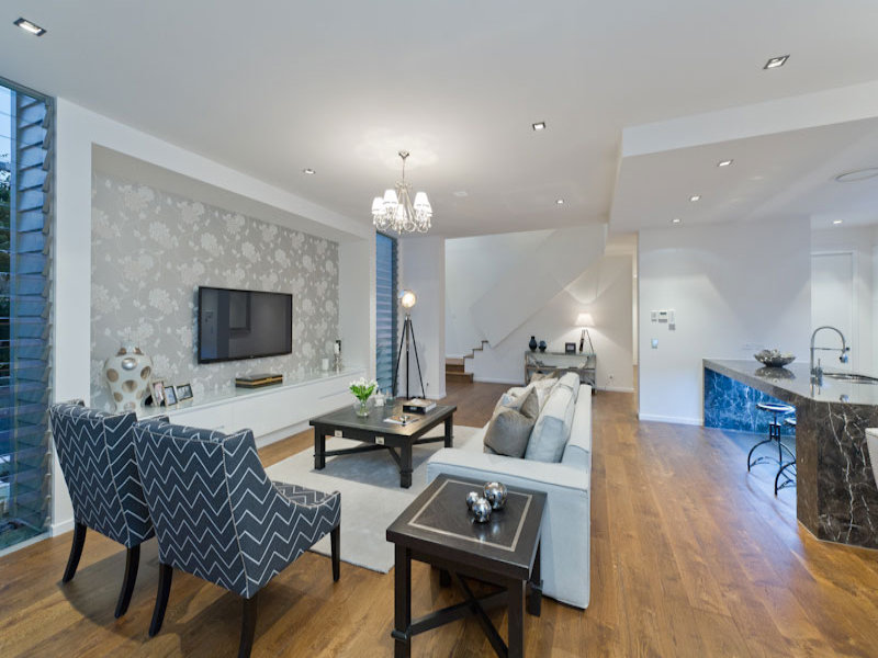 Kitchenliving living room using grey colours with floorboards & built