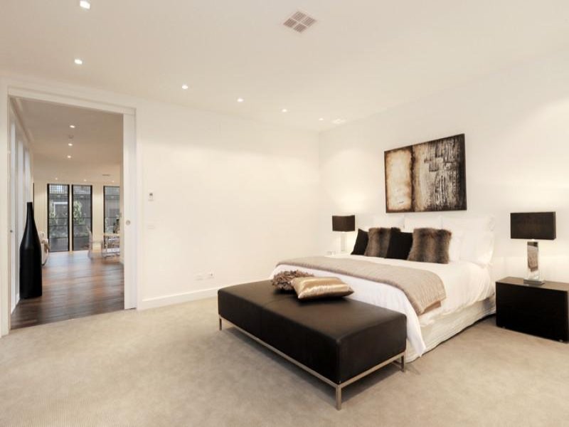 Modern bedroom design idea with carpet & bifold doors using beige colours Bedroom photo 440373